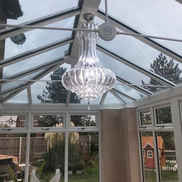 Interior view of conservatory with chandelier by Allerton Windows.