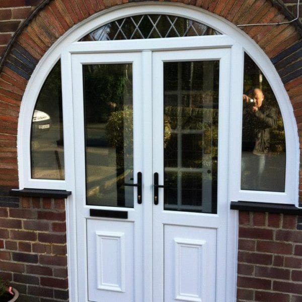 French doors with porch extension with semi-circle windows by Allerton Windows.