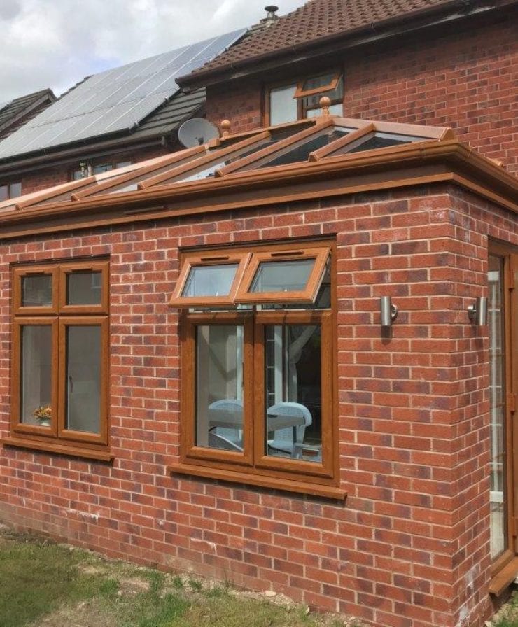 Classic wood-effect orangery extension in Chester by Allerton Windows.