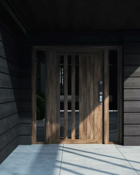 Modern wooden front door idea with deep wood panelling and lightwood door. Photo by Bilal Mansuri: https://www.pexels.com/photo/house-with-a-wooden-door-13203181/