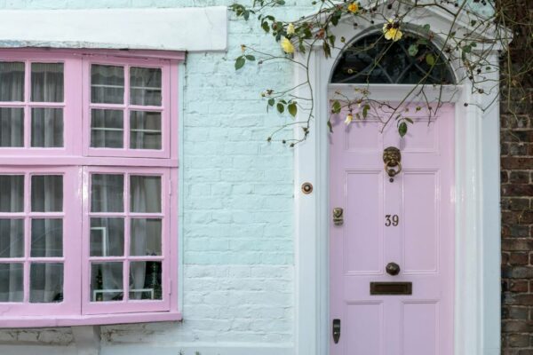 Pink house with lion door knocker for blog on front door ideas.