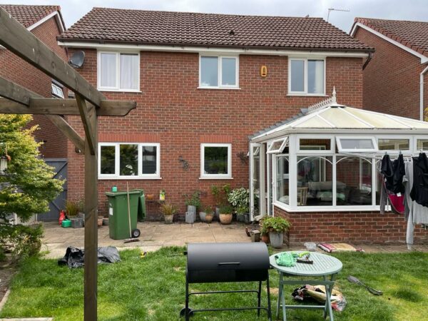 Before picture of kitchen conservatory extension at Penrose Gardens by Allerton Windows.