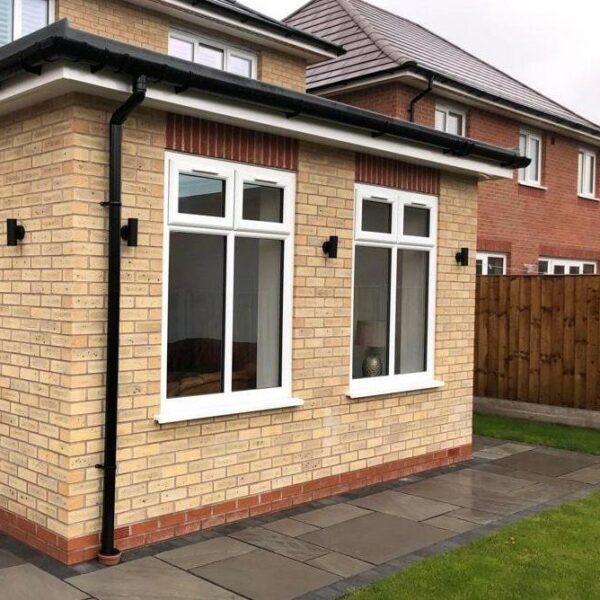 Single storey home extension with UPVC tilted casement windows in Liverpool.