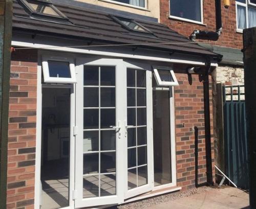 Small kitchen extension with french doors in Crosby by Allerton Windows.